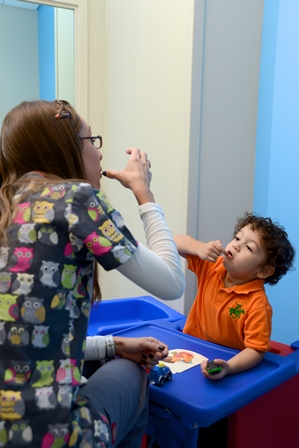 Jennifer Gomez, Speech-language pathologist, and Jacob Iglesias during a speech therapy session at the MCH Miami Lakes Outpatient Center